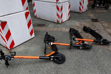 E-scooters lay on the ground in Frankfurt, Germany. Cobbled streets are proving a challenge for e-scooter firms. Reuters