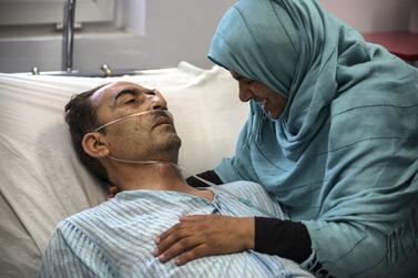 Shir Ali, 49, lies in hospital with his wife Qudsia, 48, by his side. The shock and pain of Monday's attack is raw. Stefanie Glinski for The National 