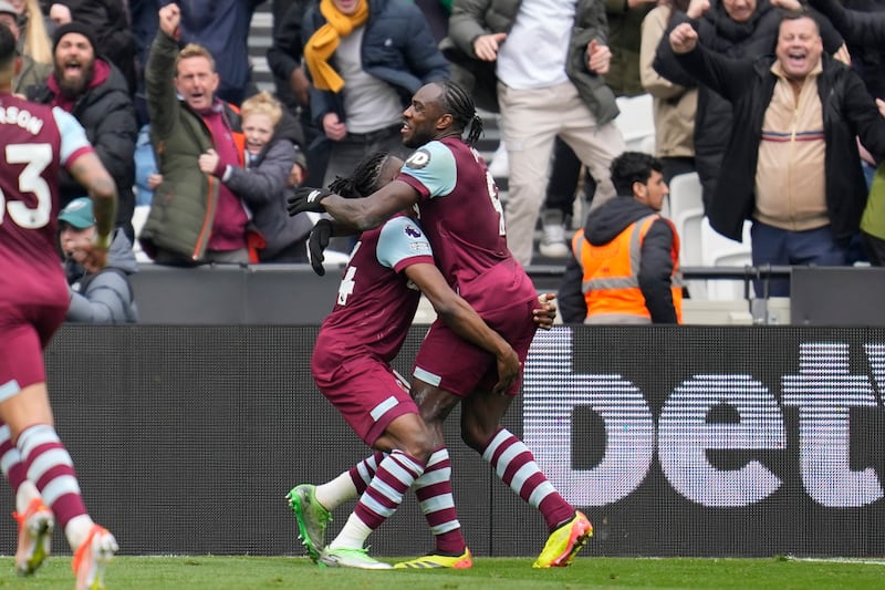 West Ham's Michail Antonio, right, celebrates with teammate Mohammed Kudus after scoring to make it 2-2. AP
