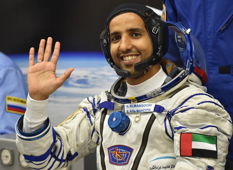 epa07868727 Member of the main crew to the International Space Station (ISS) United Arab Emirates' astronaut Hazza Al Mansouri waves before boarding a Soyuz rocket to the International Space Station (ISS) at the Russian-leased Baikonur cosmodrome in Kazakhstan, 25 September 2019. Mansouri will be the first Emirati in space.  EPA/VYACHESLAV OSELEDKO / POOL