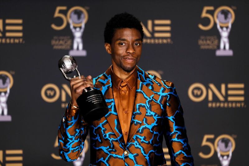 epa08776977 YEARENDER 2020 
FAREWELLS

US actor Chadwick Boseman holds the 'Outstanding Actor in a Motion Picture' award for 'Black Panther' in the press room during the 50th NAACP Image Awards at the Dolby Theatre in Hollywood, California, USA, 30 March 2019. Chadwick Boseman passed away age 43 after a four year battle with colon cancer on 28 August 2020.  EPA/ETIENNE LAURENT