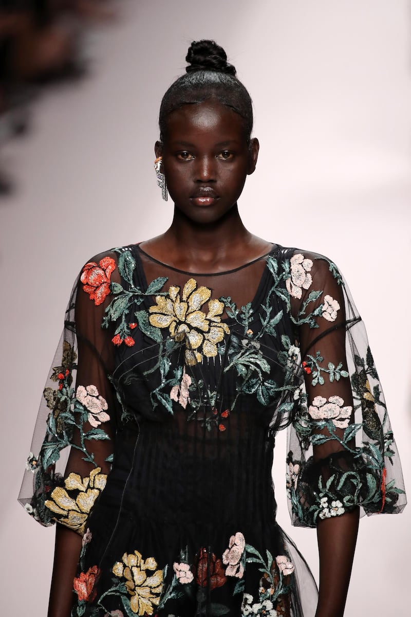 MILAN, ITALY - SEPTEMBER 20: Adut Akech, fashion detail, walks the runway at the Fendi show during Milan Fashion Week Spring/Summer 2019 on September 20, 2018 in Milan, Italy.  (Photo by Andreas Rentz/Getty Images)