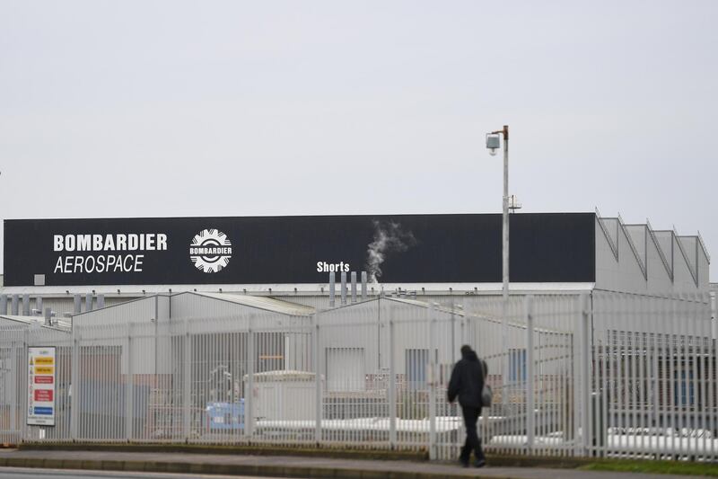 FILE PHOTO: A man walks past the Bombardier plant in Belfast, Northern Ireland January 26, 2018. REUTERS/Clodagh Kilcoyne/File Photo