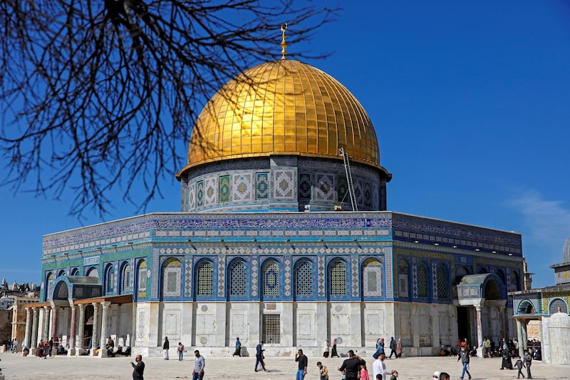 Palestinian Muslims resume Friday prayer at the Dome of the Rock Mosque in Jerusalem's al-Aqsa mosque compound on February 12, 2021, following a 45-day pause due to COVID-19 restrictions. (Photo by AHMAD GHARABLI / AFP)