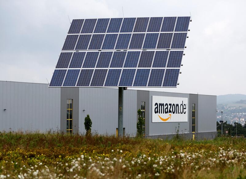 FILE PHOTO: Photovoltaic panels stand in front of the Amazon distribution centre in Bad Hersfeld September 22, 2014. REUTERS/Kai Pfaffenbach/File Photo