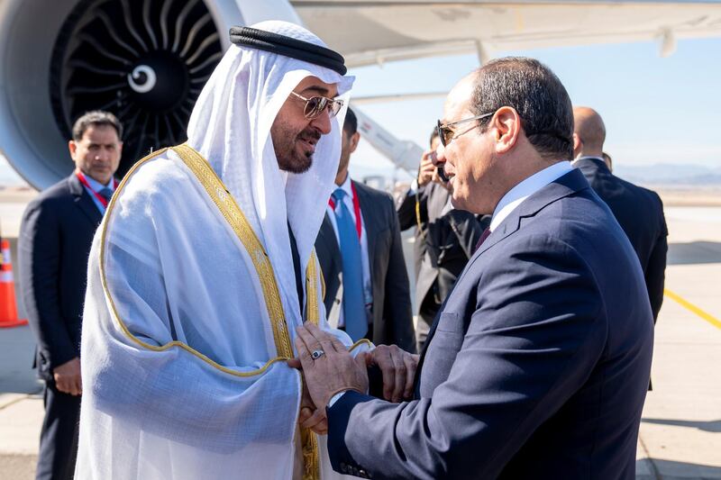 BERENICE, EGYPT - January 15, 2020: HH Sheikh Mohamed bin Zayed Al Nahyan, Crown Prince of Abu Dhabi and Deputy Supreme Commander of the UAE Armed Forces (L) is received by HE Abdel Fattah El Sisi, President of Egypt (R), upon arrival at Berenice Military Base.

( Hamad Al Kaabi /  Ministry of Presidential Affairs )
—
