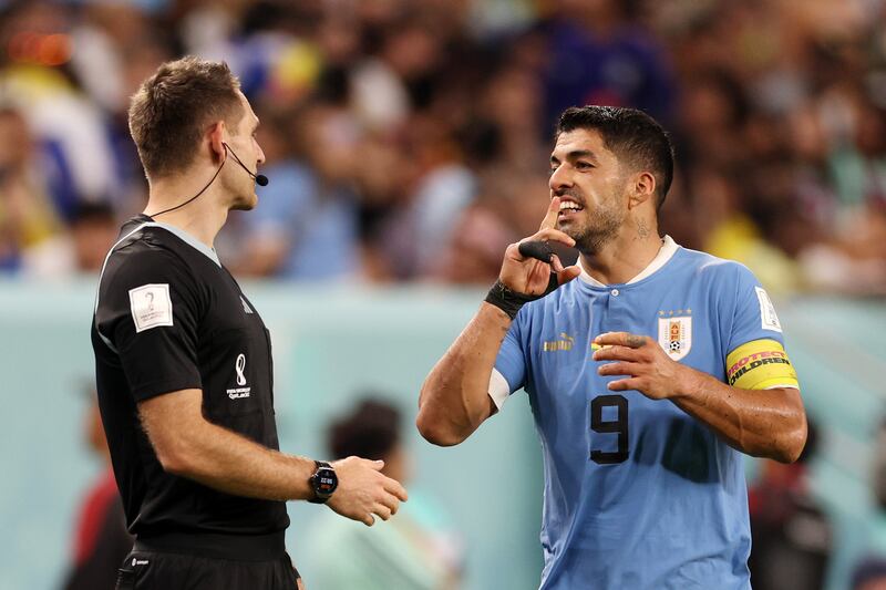 Uruguay's Luis Suarez argues with referee Daniel Siebert. Getty