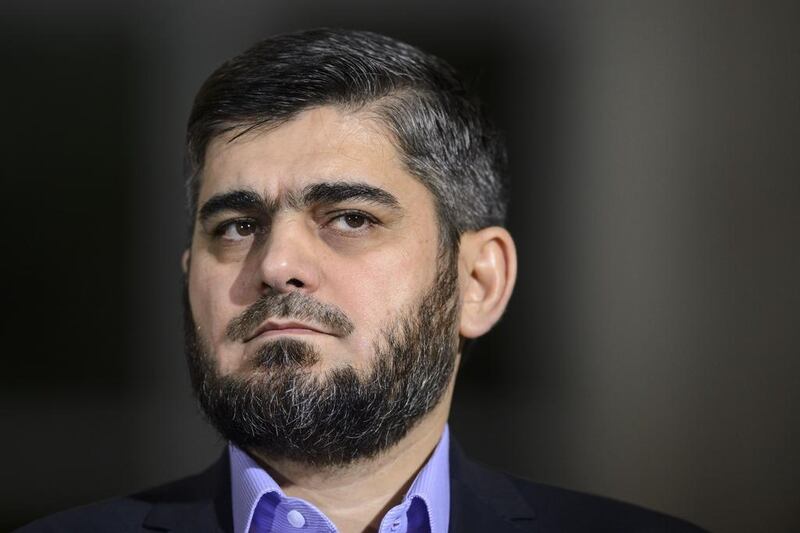 Mohammed Alloush, the Syrian opposition's chief negotiator, stood down over the continued violence carried out by Bashar Al Assad's forces. / AFP / FABRICE COFFRINI

