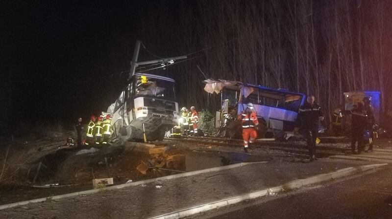 epa06390143 A handout photo made available by France Bleu Roussillon shows Emergency personnel at the crash site of a school bus with a train near Millas and Saint-Feliu-d'Amont, Southern France, 14 December 2017. Four children have been killed and at least 19 people are 'seriously injured' after the school bus was 'cut in two' parts when it was hit by the train.  EPA/Mathieu Ferri / France Bleu Roussillon HANDOUT  HANDOUT EDITORIAL USE ONLY/NO SALES