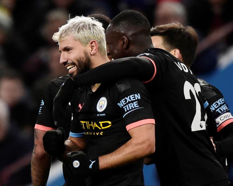 Manchester City's Sergio Aguero celebrates his goal with Benjamin Mendy on Sunday. Reuters