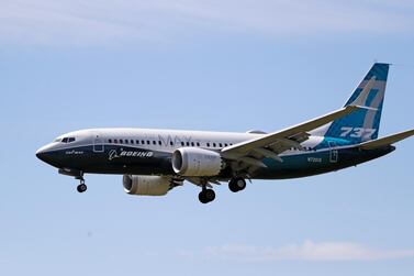 A Boeing 737 Max jet comes in to land at a Boeing air field after a test flight in June in Seattle. AP