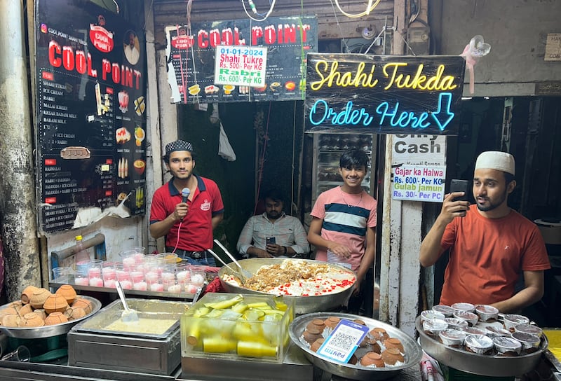 Shopkeepers selling ‘shahi tukda’ meaning royal piece, a special bread pudding in Old Delhi. T