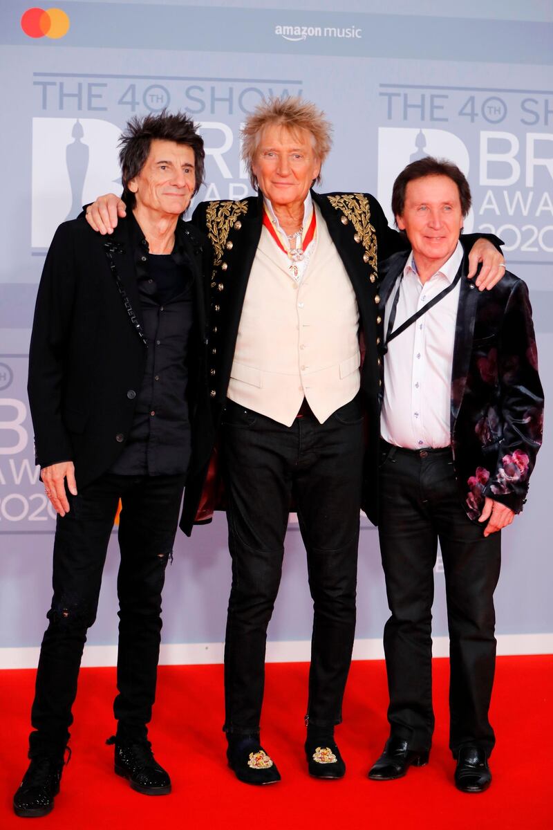 British musicians Ronnie Wood, Rod Stewart and Kenney Jones arrive at the Brit Awards 2020 at The O2 Arena on Tuesday, February 18, 2020 in London, England. AFP