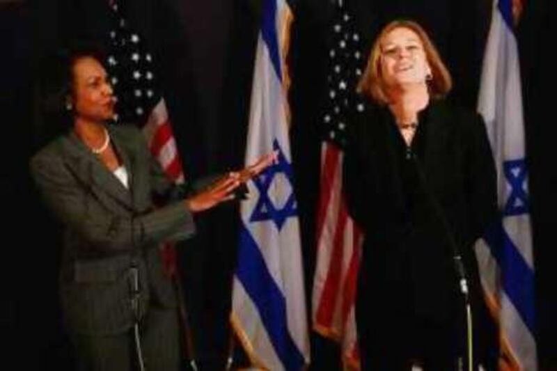 US Secretary of State Condoleezza Rice, left, gestrures as she speaks with Israel's Foreign Minister Tzipi Livni during a press conference in Jerusalem, Tuesday, Aug. 26, 2008. Making another Mideast trip to prod Israelis and Palestinians closer as hopes for a peace deal by year's end fade, U.S. Secretary of State Condoleezza Rice had little to say Tuesday beyond describing negotiations as "serious" and adding that Israeli settlement is unhelpful. (AP Photo/David Silverman, Pool)