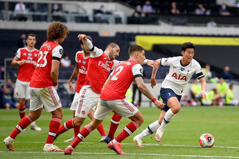 Son Heung-min runs at the Arsenal defence. AP