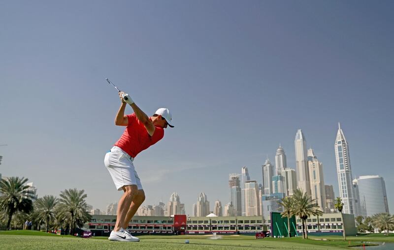 DUBAI, UNITED ARAB EMIRATES - JANUARY 23: Rory McIlroy of Northern Ireland plays a shot on the 18th hole as a preview for the Omega Dubai Desert Classic on the Majlis Course at The Emirates Golf Club on January 23, 2018 in Dubai, United Arab Emirates.  (Photo by David Cannon/Getty Images)