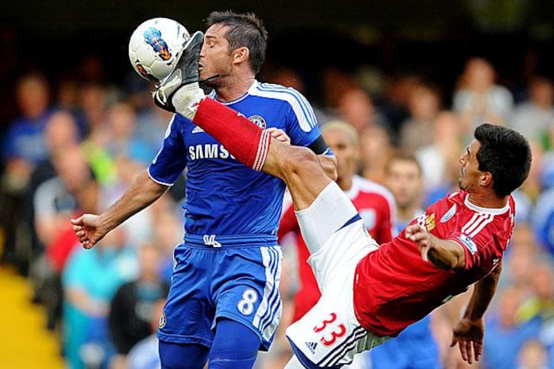 Frank Lampard risks a bloody nose as Paul Scharner, the West Brom midfielder, raises his foot in his side's 2-1 defeat to Chelsea at Stamford Bridge.

Laurence Griffiths / Getty Images