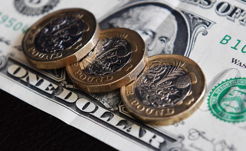 epa06983227 The British pounds and US dollar in London, Britain, 30 August 2018. According to reports, the pound has jumped over 1.30 mark to US dollar on 30 August, following hints from EU Chief Negotiator Michel Barnier that the EU may be prepared to offer the UK a unique trade deal.  EPA/ANDY RAIN