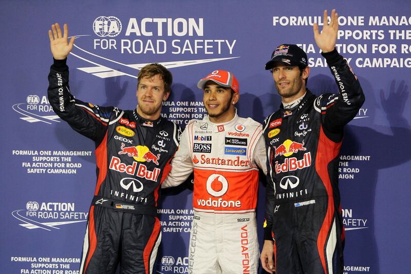 Abu Dhabi, United Arab Emirates, November 3, 2012:    McLaren Formula One driver Lewis Hamilton, center, of Great Britain took the pole position ahead of Red Bull Formula One driver Sebastian Vettel, left, of Germany and his team mate Mark Webber of Australia during the qualifying session of the Formula 1 Etihad Airways Abu Dhabi Grand Prix at Yas Marina Circuit in Abu Dhabi on November 3, 2012. Christopher Pike / The National






