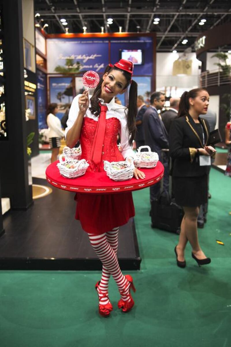 “I wear what they tell me to wear”, says Kamila Fowdes, who is channelling her inner Alice-in-Wonderland and handing out lollipops to strangers, on behalf of Damac, the luxury property construction company. Lee Hoagland / The National