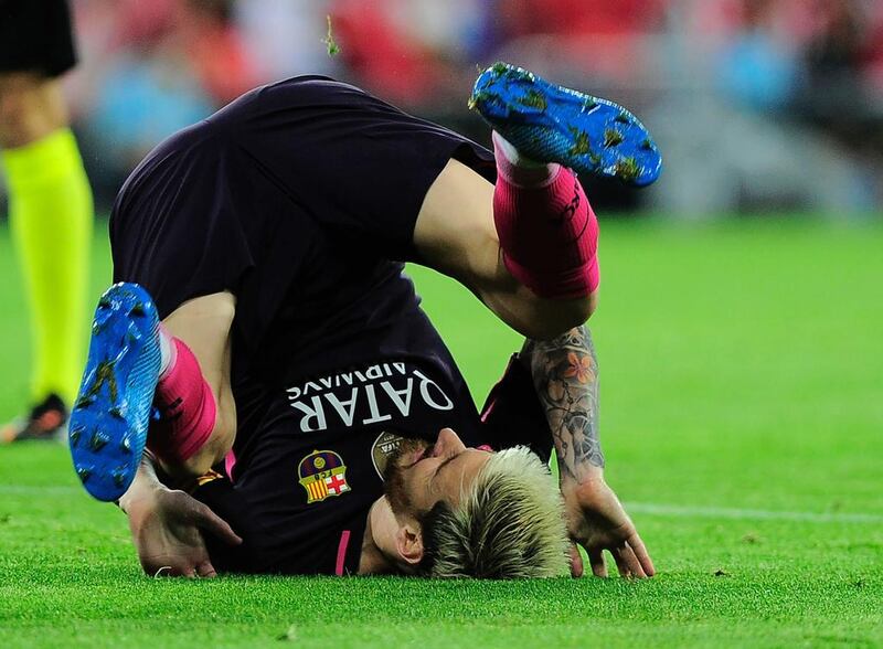 Barcelona’s Lionel Messi falls during the match against Athletic Bilbao. Ander Gillenea / AFP