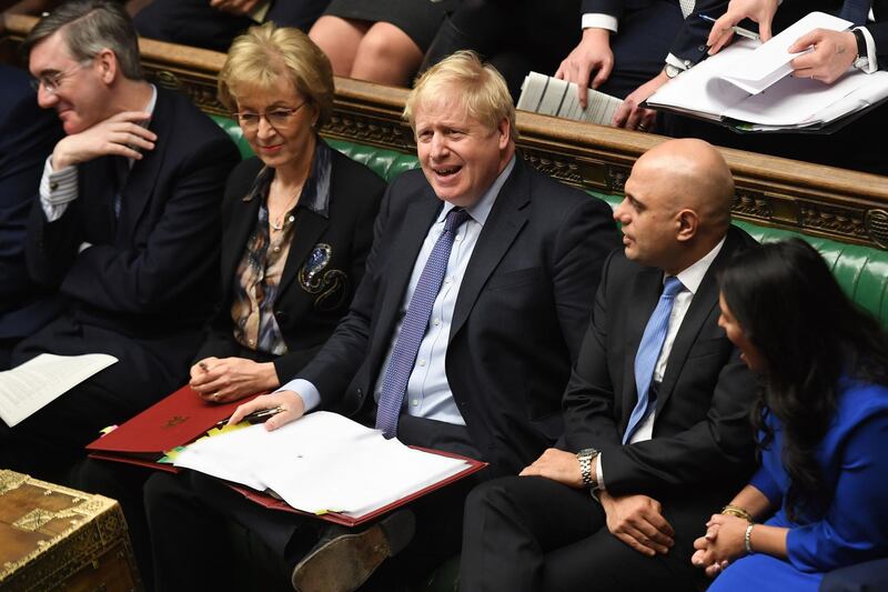 A handout photograph released by the UK Parliament shows Britain's Prime Minister Boris Johnson (C) and Britain's Leader of the House of Commons Jacob Rees-Mogg (L), Britain's Business Secretary Andrea Leadsom (2L), Britain's Chancellor of the Exchequer Sajid Javid (2R) and Britain's Home Secretary Priti Patel reacting in the House of Commons in central London on February 5, 2020, during the Prime Minister's Questions (PMQ) session.   - RESTRICTED TO EDITORIAL USE - NO USE FOR ENTERTAINMENT, SATIRICAL, ADVERTISING PURPOSES - MANDATORY CREDIT " AFP PHOTO / Jessica Taylor /UK Parliament"
 / AFP / UK PARLIAMENT / HO / RESTRICTED TO EDITORIAL USE - NO USE FOR ENTERTAINMENT, SATIRICAL, ADVERTISING PURPOSES - MANDATORY CREDIT " AFP PHOTO / Jessica Taylor /UK Parliament"
