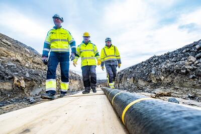 Engineers inspect part of the subsea electricity cable before it is laid. The seabed is not just home to communication and data cables, but electric and gas pipelines. PA