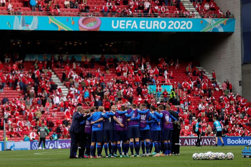 Finland players gather on the pitch. AP