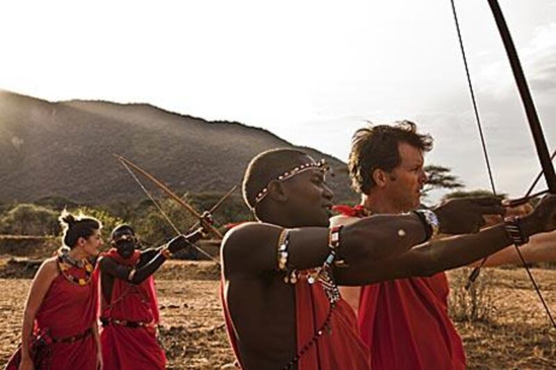 Guests are taught hunting skills by Masai warriors on a Bush Adventures holiday in Kenya.