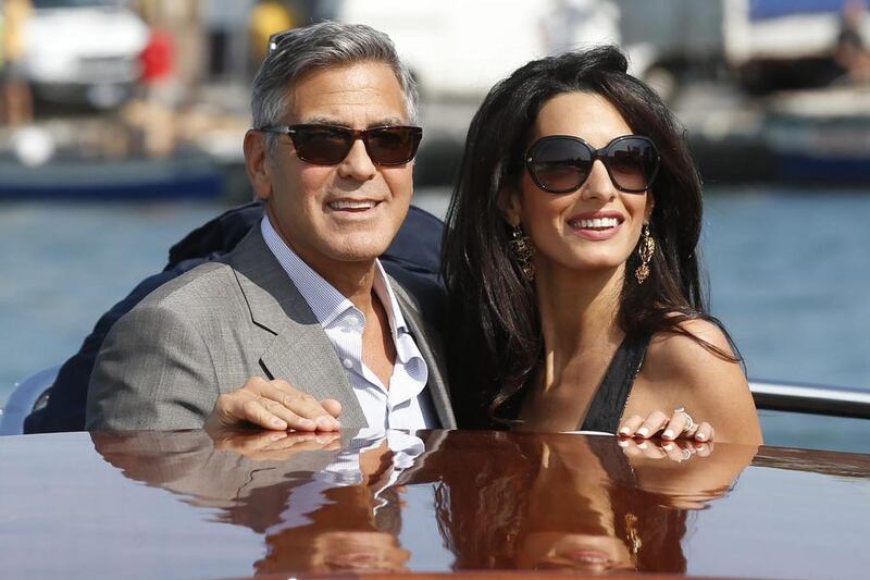 George Clooney and Amal arrive in Venice. AP