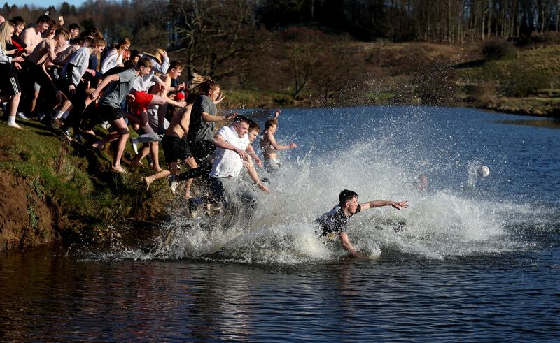 People from rival parishes of St Michael and St Paul compete in Scoring the Hales annual Shrove Tuesday Football match in Alnwick. Reuters