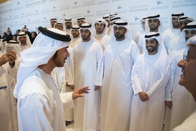 Sheikh Hazza bin Zayed, Vice Chairman of the Abu Dhabi Executive Council, speaks with Adwea staff during the inauguration ceremony yesterday at Emirates Palace of the new Sweihan Solar Photovoltaic Plant. Hamad Al Kaabi / Crown Prince Court – Abu Dhabi