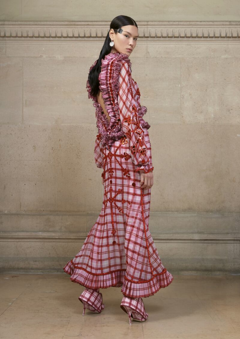 In a bold move, Givenchy opted to open its haute couture show with intricate checks that were skilfully carved around the body. A deep-cut back, framed by thickly pleated ruffles (which were echoed around the waist and hem) felt fluid and vaguely Spanish, while naive embroidery across the body and sleeves felt reminiscent of traditional Palestinian textiles. Courtesy of Givenchy