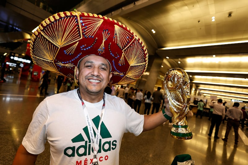 A low-key Mexico fan brings a replica World Cup to Qatar. Reuters