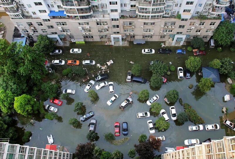Automobiles are seen flooded at a neighbourhood in Wuhan, Hubei province, China. Darley Shen / Reuters