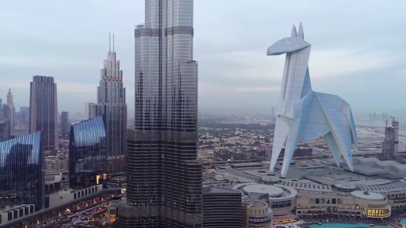 An origami horse stands alongside Dubai's spectacular Burj Khalifa. 