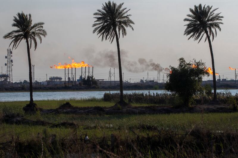 The Nihran Bin Omar oil field flare stacks burn north of Basra, Iraq. AP