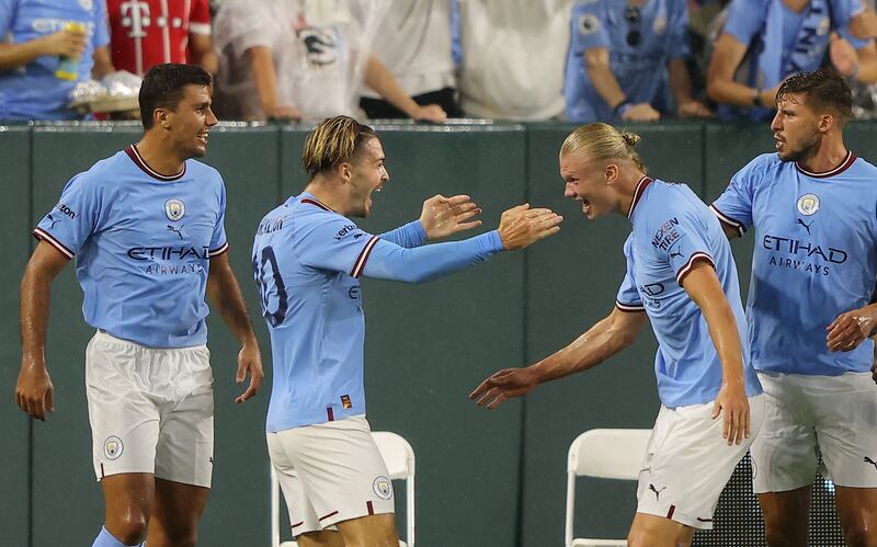 Erling Haaland celebrates with teammates after scoring Manchester City's first goal. Getty
