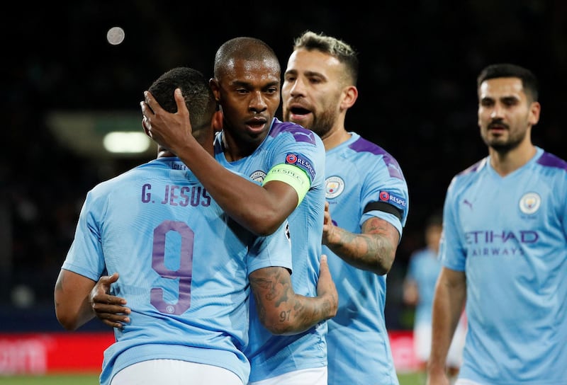 Manchester City's Gabriel Jesus celebrates scoring their third goal with Fernandinho, Nicolas Otamendi and Ilkay Gundogan. Reuters