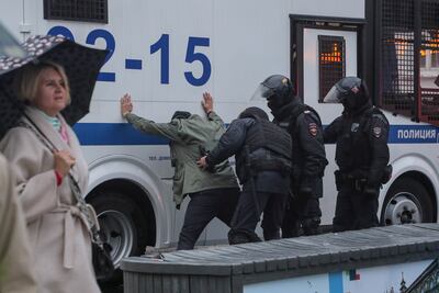 Russian policemen detain a protester in Moscow. EPA