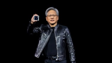 Nvidia chief executive Jensen Huang displays the new Blackwell GPU chip during the GTC conference in San Jose, California. Bloomberg