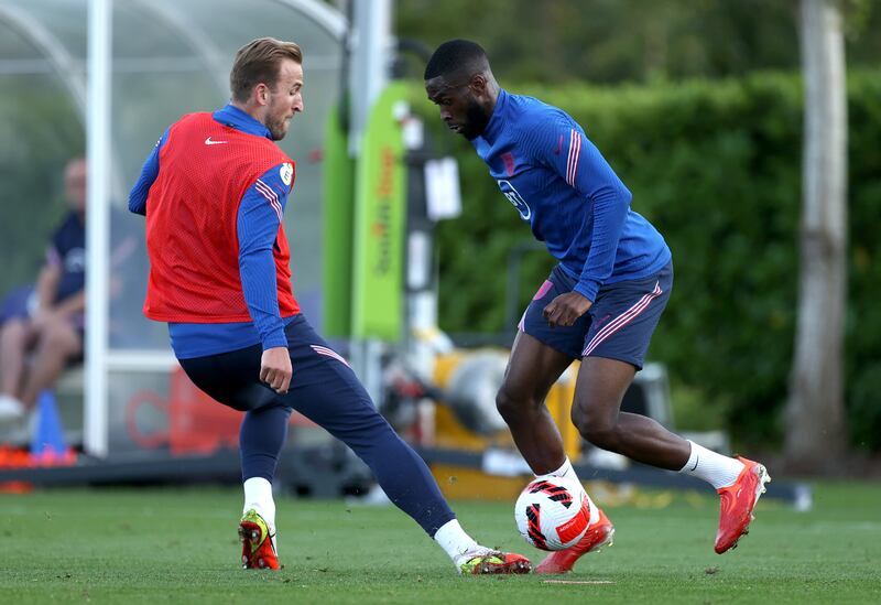 Fikayo Tomori is challenged by teammate Harry Kane during a training session at Tottenham Hotspur Training Centre.s