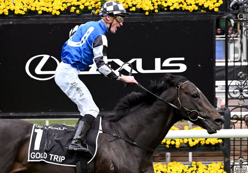 Gold Trip, ridden by Mark Zahra, crosses the line to win the A$8 million Melbourne Cup horse race at Flemington Racecourse on November 1, 2022. AFP