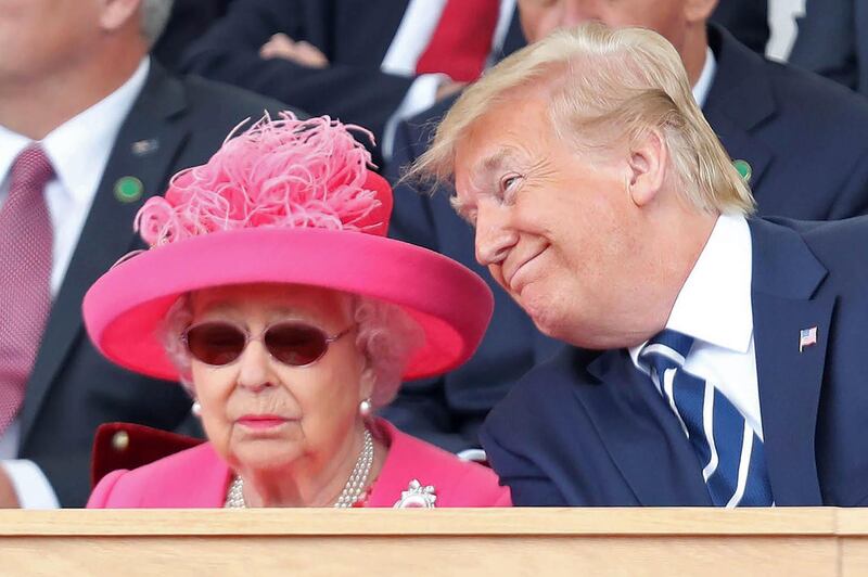 Britain's Queen Elizabeth II (L) and US President Donald Trump react during an event to commemorate the 75th anniversary of the D-Day landings, in Portsmouth, southern England.  AFP