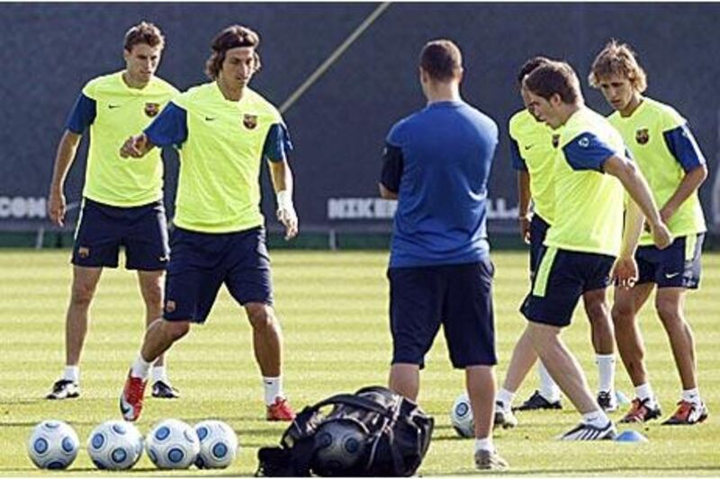 Zlatan Ibrahimovic, second left, who signed for Barcelona from Italian champions Inter Milan in a swap deal with Samuel Eto'o, trains with his new teamates ahead of tonight's Super Cup against Bilbao.