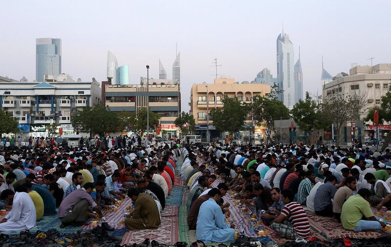 Dubai ,United Arab Emirates- July,16, 2015:  People  gather to break the fast on the last of the Ramadan near satwa area  in Dubai . ( Satish Kumar / The National ) For News *** Local Caption ***  SK-Ramadan-16072015-03.jpg
