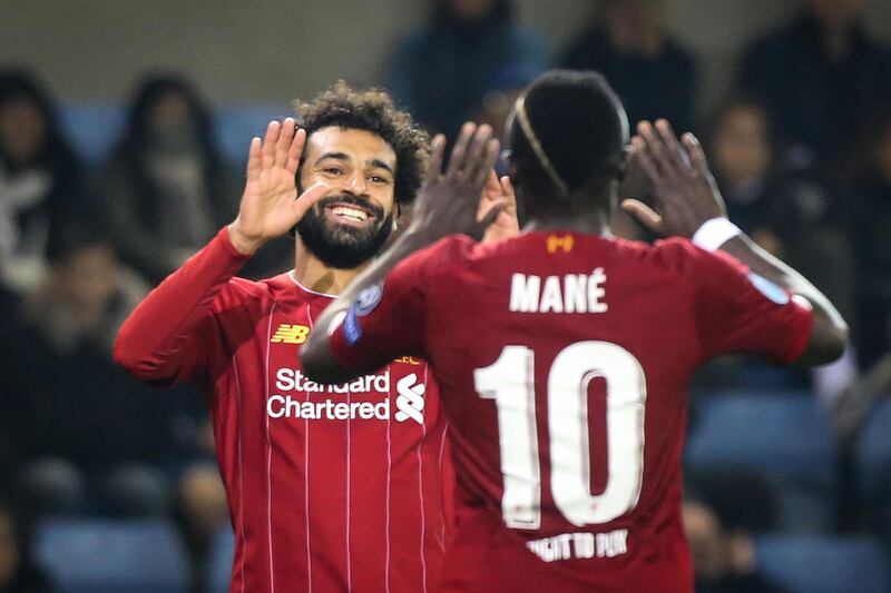 Mohamed Salah (L) celebrates with Sadio Mane (R) after scoring against Genk. AFP