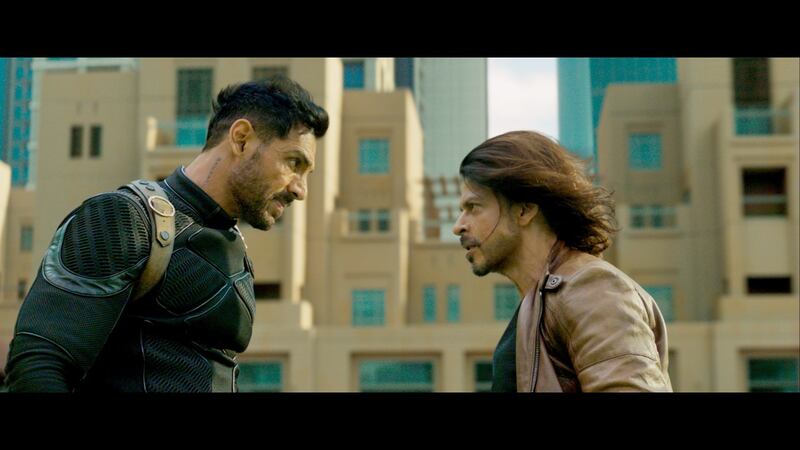 John Abraham and Khan in a Pathaan scene that was shot in Downtown Dubai. The thriller has become the highest-grossing film in Khan's career. Photo: Yash Raj Films
