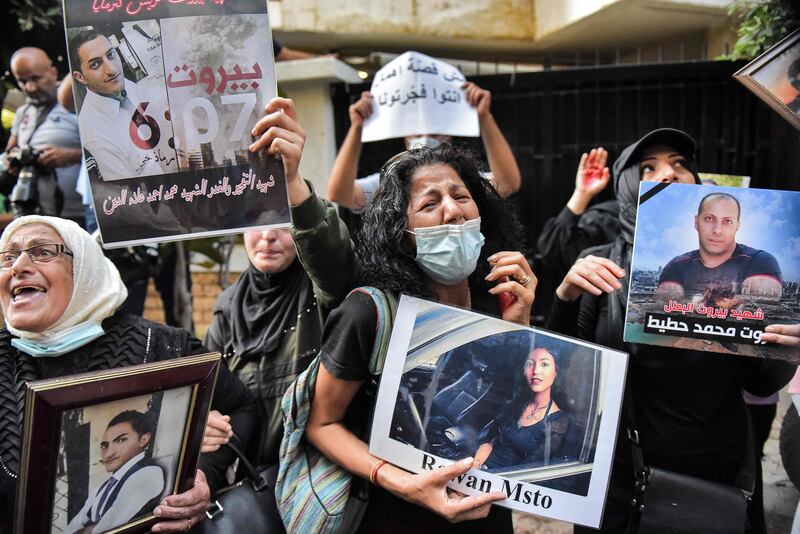 Demonstrators and families of the Beirut blast victims chant slogans during a protest outside the residence of Lebanon's interior minister in the Qoraitem neighbourhood of western Beirut.