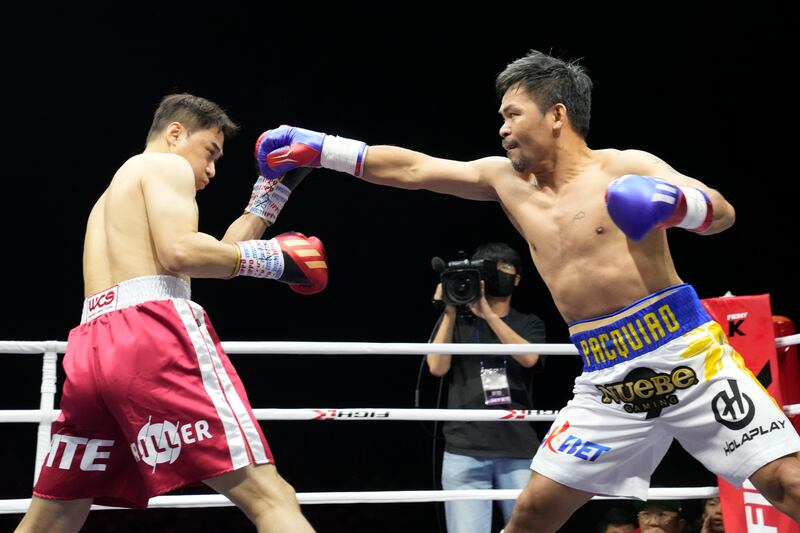 Manny Pacquiao throws a jab at DK Yoo during the first round of their exhibition bout. AP